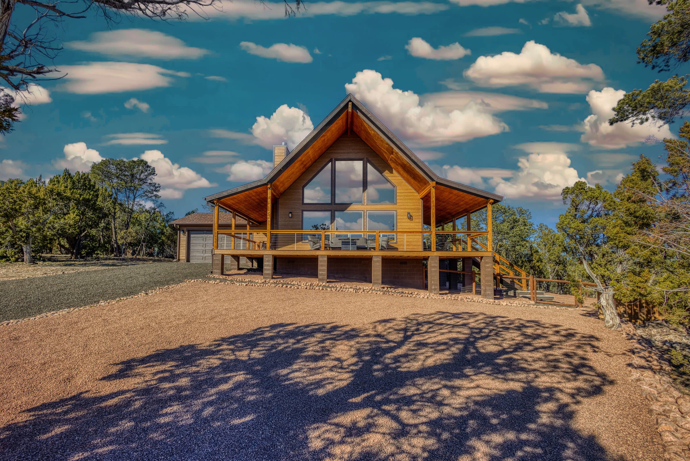 Carefree Cabin's A-frame exterior against the Heber sky